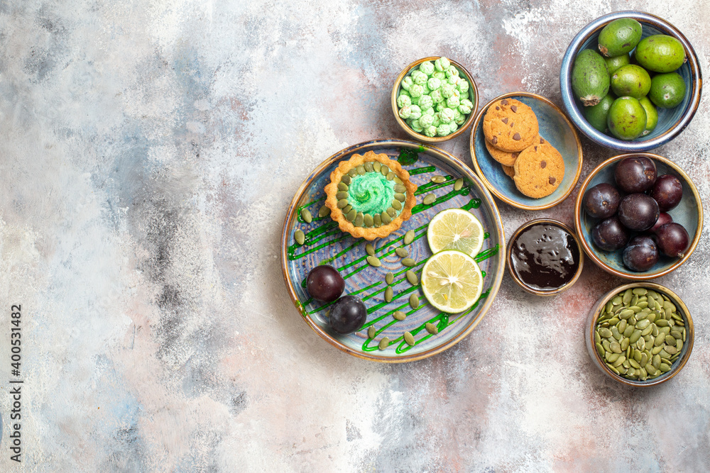 top view yummy creamy cake with fruits on light background sweet candy biscuit top view yummy creamy cake with fruits on light background sweet candy biscuit