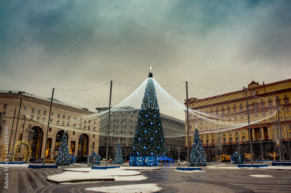 New Year tree on the (Lubyanskaya) Lubyanka Square in front of Detsky Mir (Children's World) children's retail store, one of the tallest christmas trees in Moscow, Russia