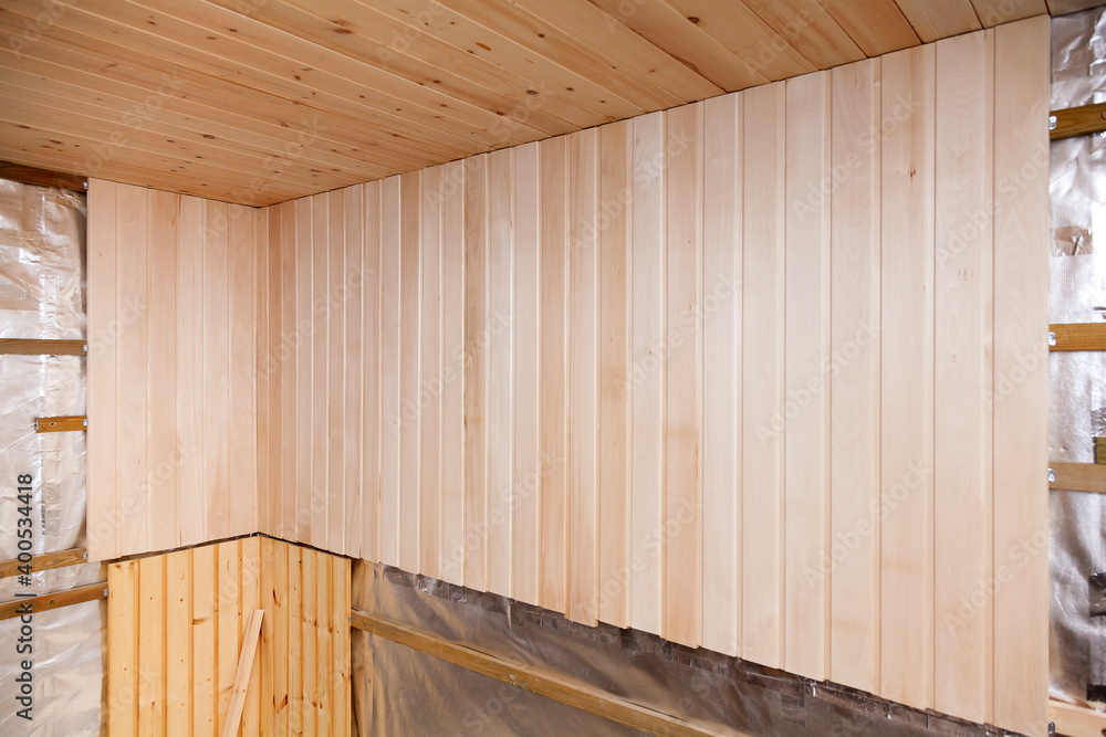 Wooden walls of a traditional sauna. Construction in progress Wooden walls of a traditional sauna. Construction in progress