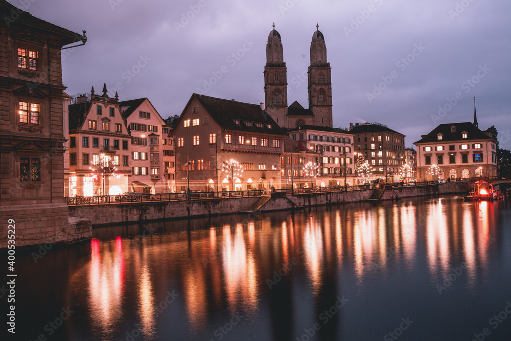 Naklejka premium VIew of Grossmünster Church across the Limmit River in Zurich, Switzerland