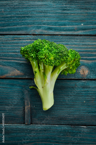 Fresh green broccoli on dark old background. Top view. Free space for your text.