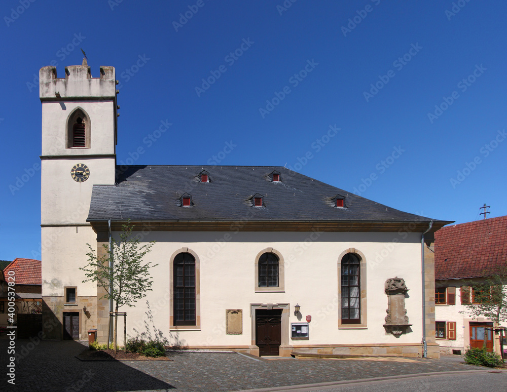 Fototapeta premium Baroque church with gothic bell tower in the village of Rehborn, Pfalz region in Germany