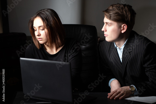 A man and a girl in the off...
