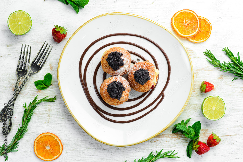 Eclairs with poppy seeds and cream. Top view. Free space for text. Eclairs with poppy seeds and cream. Top view. Free space for text.
