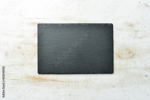 Slate black stone plate. Top view. Free copy space.