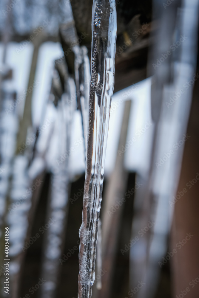 Transparent icicles hanging from the roof. December 2020 Transparent icicles hanging from the roof. December 2020