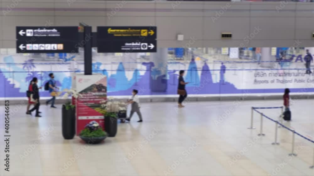 High view shot of Passengers are walking in a lonely airport. Because of the coronavirus(Covid-19) crisis All wearing masks. blur focus.
High view shot of Passengers are walking in a lonely airport. Because of the coronavirus(Covid-19) crisis All wearing masks. blur focus.
