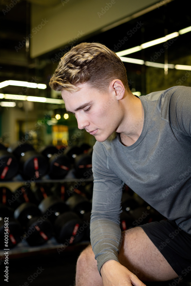 Young athlete men has fit training in the gym Young athlete men has fit training in the gym