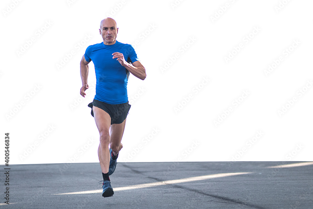 Fototapeta premium Sportsman running fast on the road