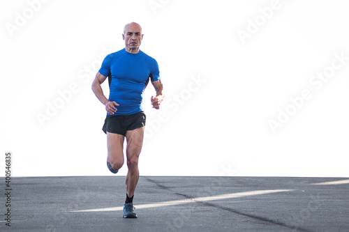 Photo with copy-space of a sportsman running on the road © carlesiturbe