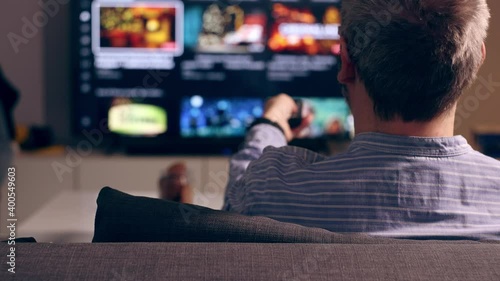 Person watching tv at home.