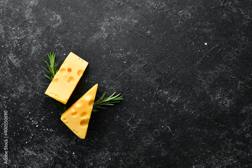 Yellow cheese with holes. Dairy products. Top view. Free space for your text. photo