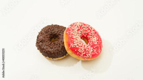 Donuts isolated on white background. Tasty glazed donuts closeup. Doughnut