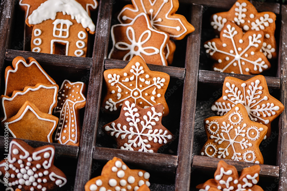 Collection of various gingerbread cookies in a box