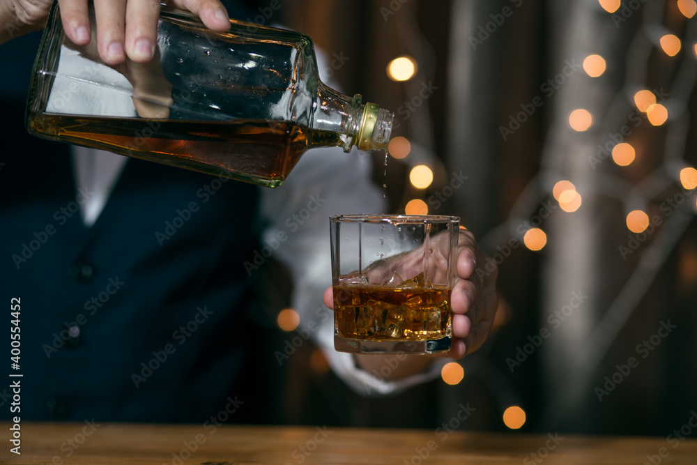 Close-up Barman pouring whiskey whiskey glass beautiful night