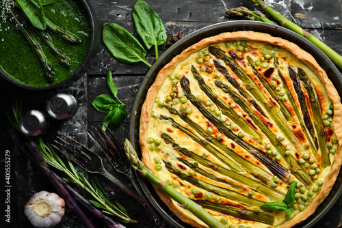 Puff pastry tart with asparagus and spices. Healthy food. Top view. Free space for your text.