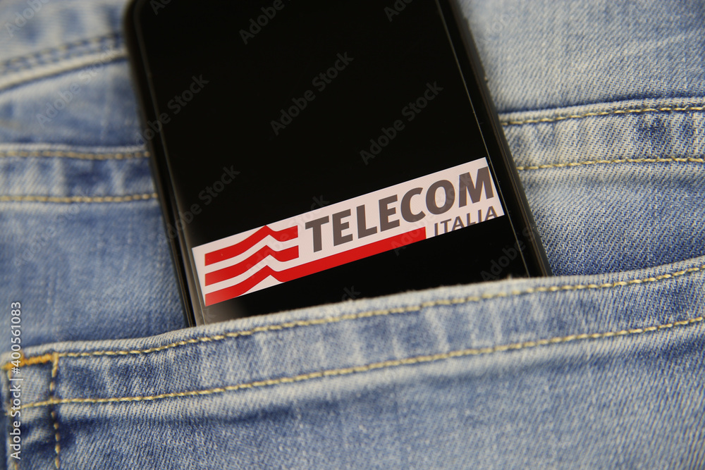 Viersen, Germany - May 9. 2020: Close up of smartphone screen in blue jeans  pocket with logo lettering of italian mobile phone provider Telecom Italia  (selective focus on center of lettering) Stock