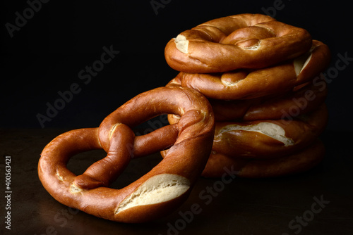 twisted soft baked pretzel on old metal tray photo