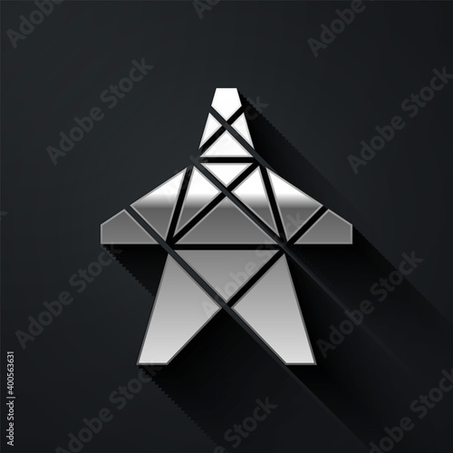 Silver Electric tower used to support an overhead power line icon isolated on black background. High voltage power pole line. Long shadow style. Vector.