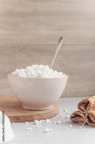 Fresh homemade crumbly cottage cheese in a large bowl