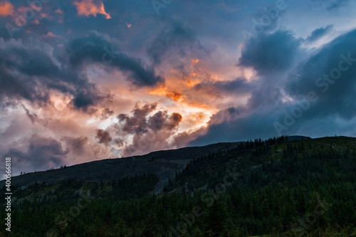 clouds at sunset over the mountains on a summer evening