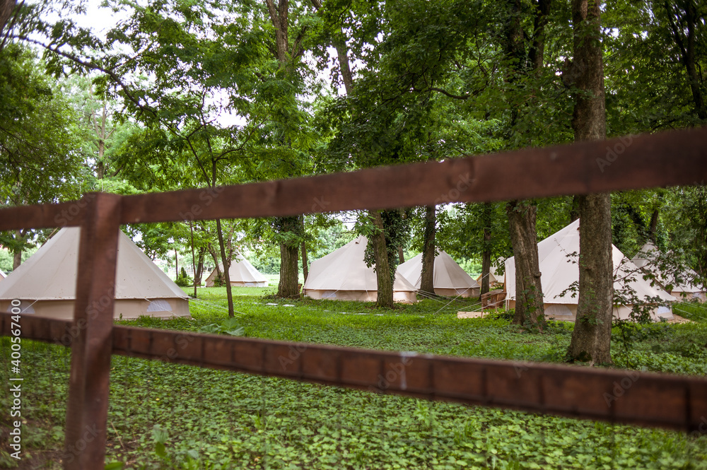 Glamping site in the woods on a calm afternoon. Glamping site in the woods on a calm afternoon.