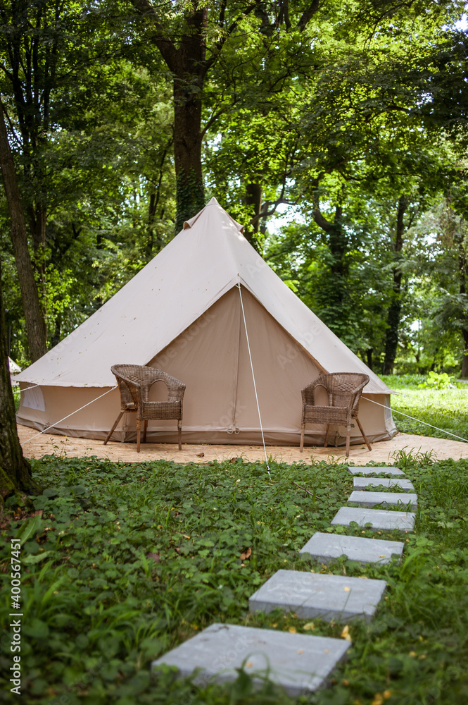 Glamping site in the woods on a calm afternoon.
