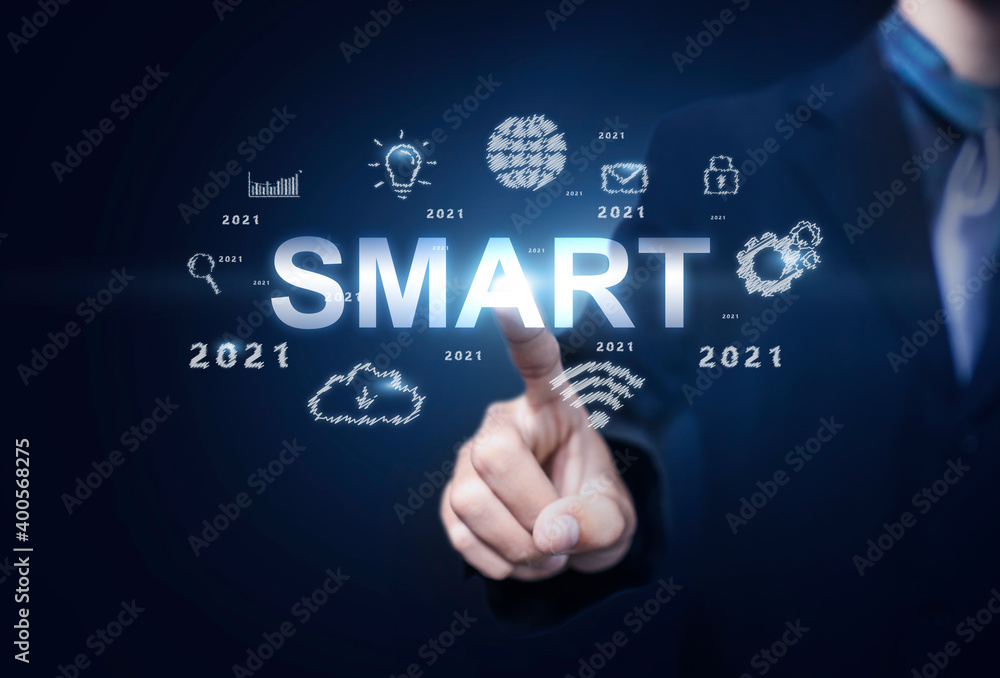Obraz premium Business and Technology smart decision action and achievement in 2021 new year resolution, planning and start up strategy ideas graphic icon concept businessman copy space blue modern background