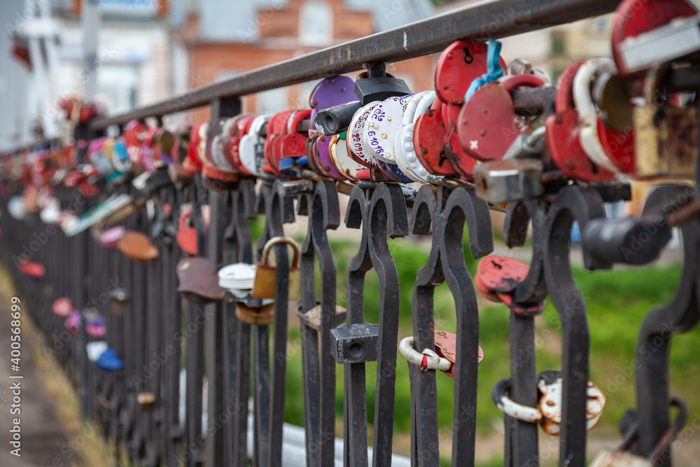 The railings of the bridge are hung with door locks that represent the loyalty of the bride and groom