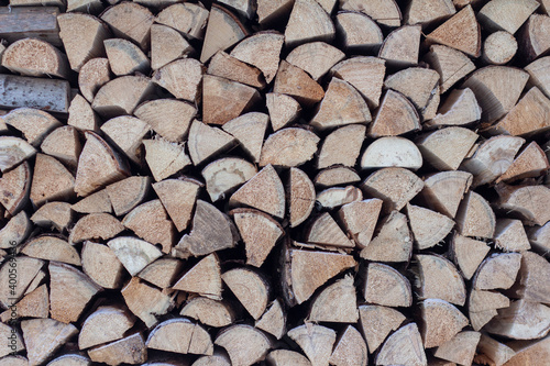 Woodpile Of Sawn Spruce Logs. Firewood For Heating The House In Winter.