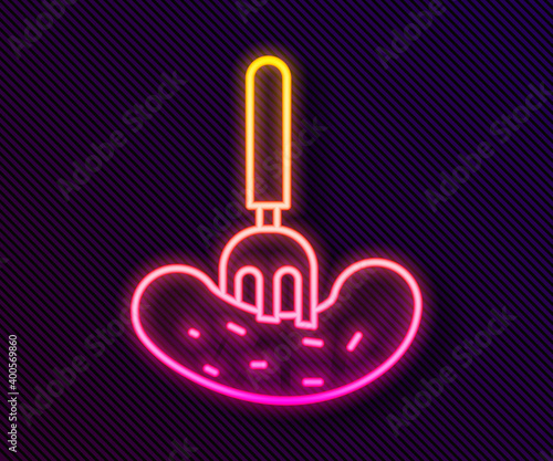 Glowing neon line Pickled cucumber on a fork icon isolated on black background. Vector Illustration.