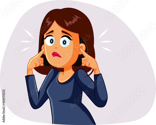 Young Woman Covering up His Ears Hearing a Stressful Noise photo