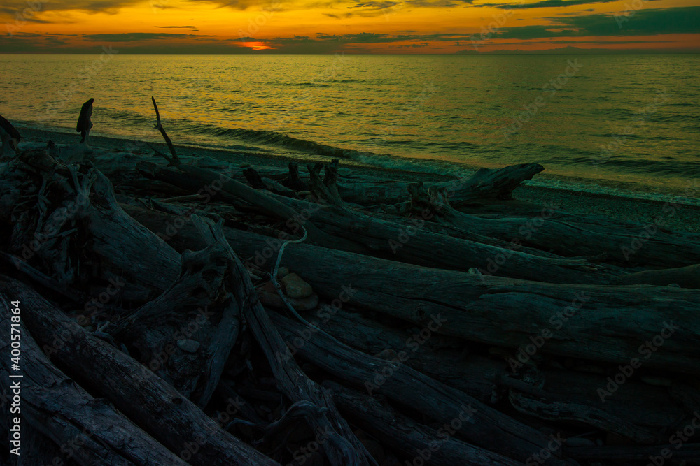 Colorful sunset view of Baltic sea shore. Estonia. The Gulf of Finland.