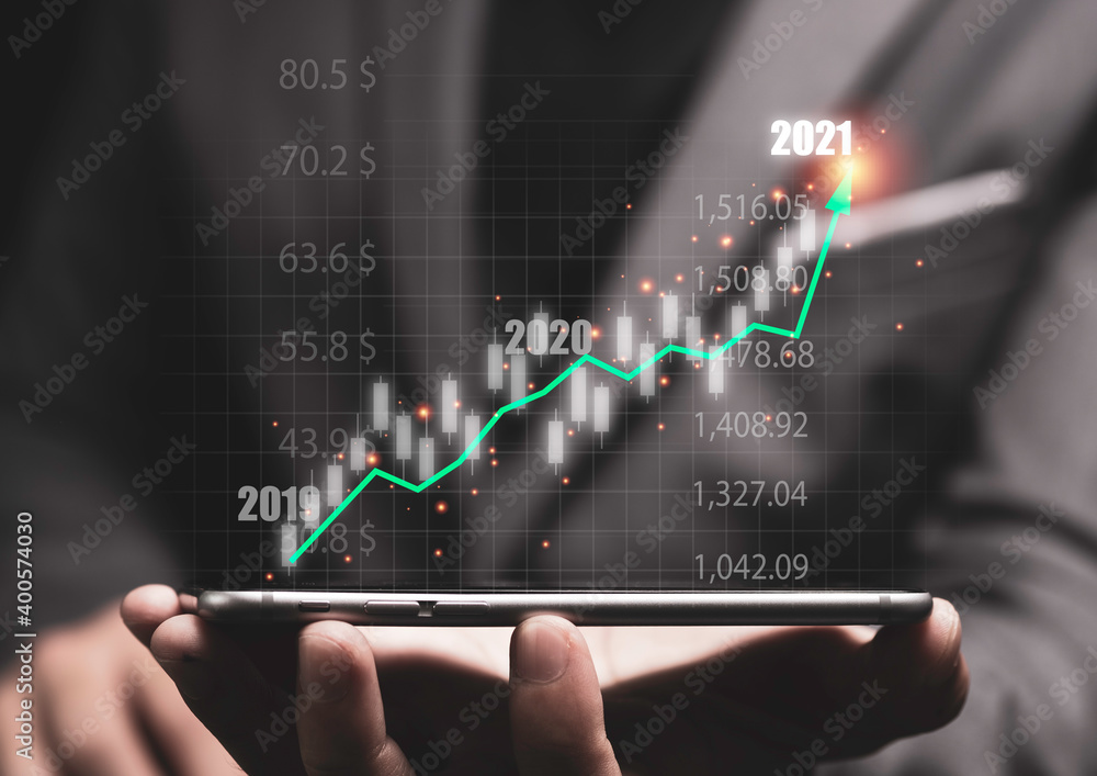 Stock market investment and business growth concept , Businessman writing stock market investment chart with increase green arrow. Stock market investment and business growth concept , Businessman writing stock market investment chart with increase green arrow.