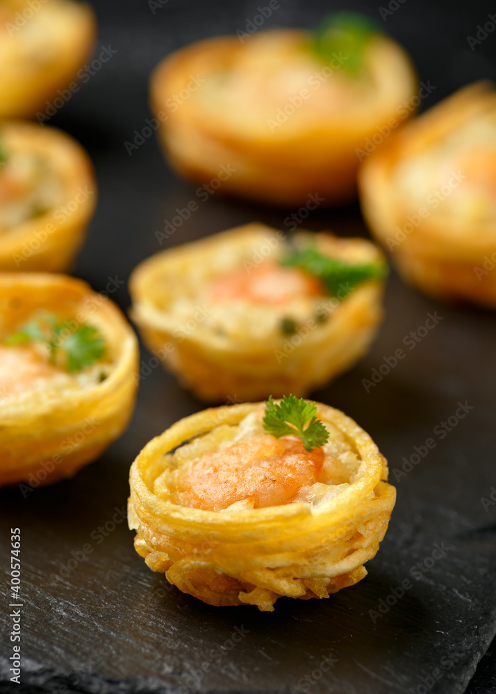 Mini party Fish Pie Food with prawn on rustic stone background Mini party Fish Pie Food with prawn on rustic stone background