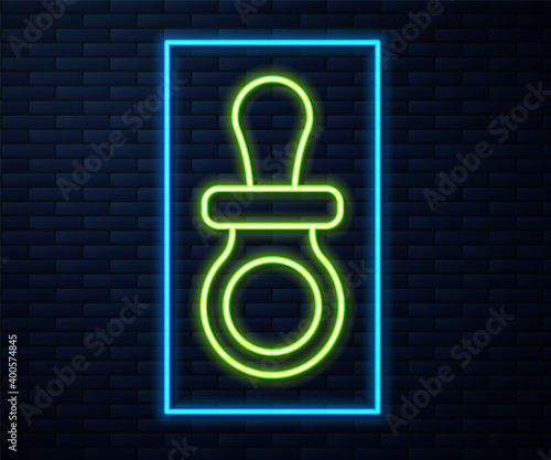 Glowing neon line Baby dummy pacifier icon isolated on brick wall background. Toy of a child. Vector.