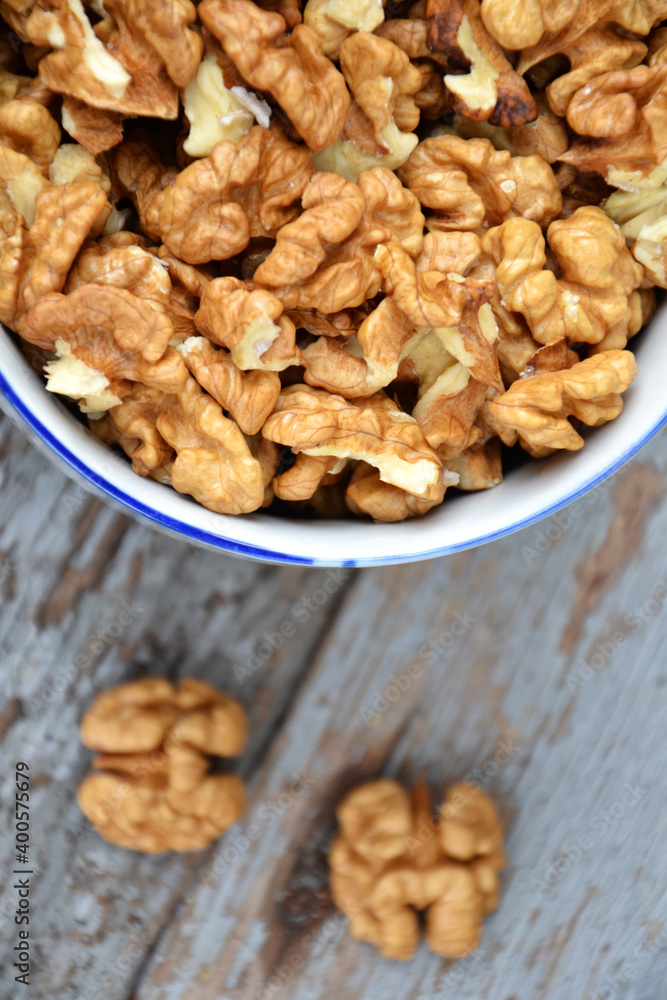 Walnut kernels in cup organic tree harvest blue wood texture 3 Walnut kernels in cup organic tree harvest blue wood texture 3