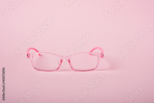 children's glasses for a girl on a pink background, horn-rimmed glasses