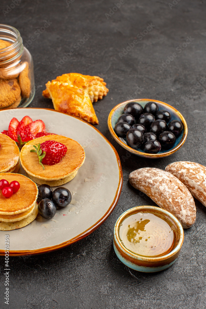 front view yummy pancakes with fruits and cakes on dark background sweet fruits cake front view yummy pancakes with fruits and cakes on dark background sweet fruits cake