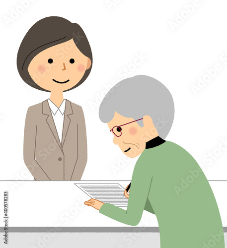 受付するスーツの女性