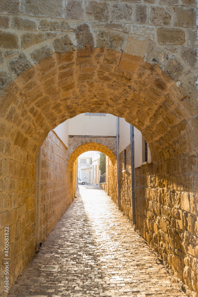 Sunset and stone arches, and old walls in Nicosia of Cyprus