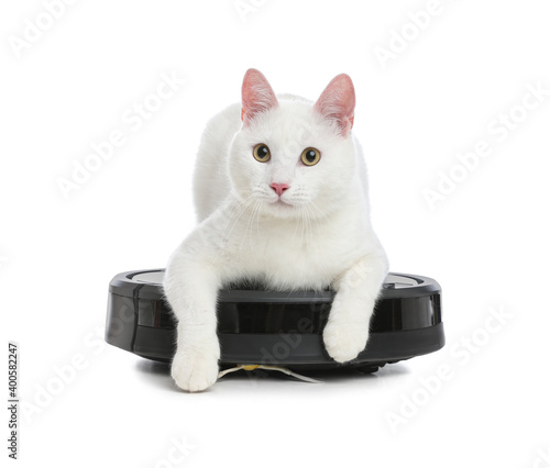 Modern robotic vacuum cleaner and cute cat on white background © New Africa