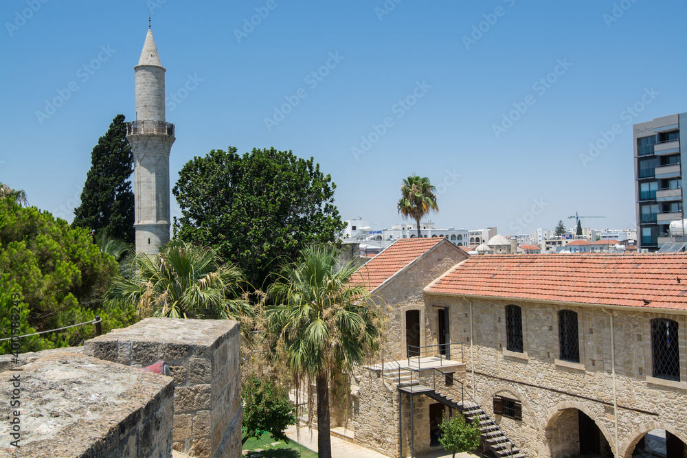 Minaret of Buyuk or Kebir Mosque and  Medieval castle in the Larnaca Fort in Cyprus