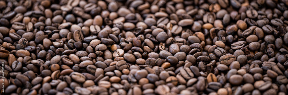 Flat lay with copy space, close-up view of some roasted coffee beans forming a natural pattern. Natural background. Flat lay with copy space, close-up view of some roasted coffee beans forming a natural pattern. Natural background.