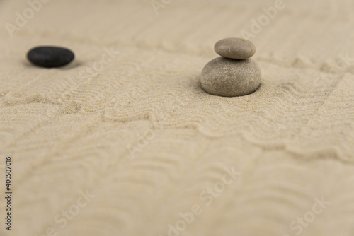 Zen sand garden meditation stone background with copy space. Stones and lines drawing in sand for relaxation. Concept of harmony  balance and meditation  spa  massage  relax. Set Sail Champagne color