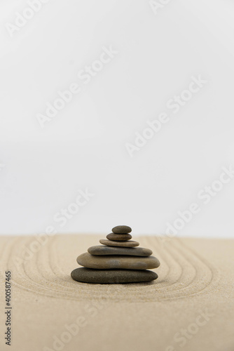 Zen sand garden meditation stone background with copy space. Stones and lines drawing in sand for relaxation. Concept of harmony  balance and meditation  spa  massage  relax. Set Sail Champagne color