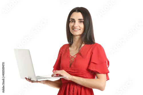 Young woman with laptop on ...