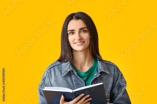 Young woman with book on co...