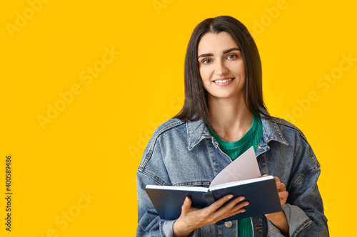 Young woman with book on co...