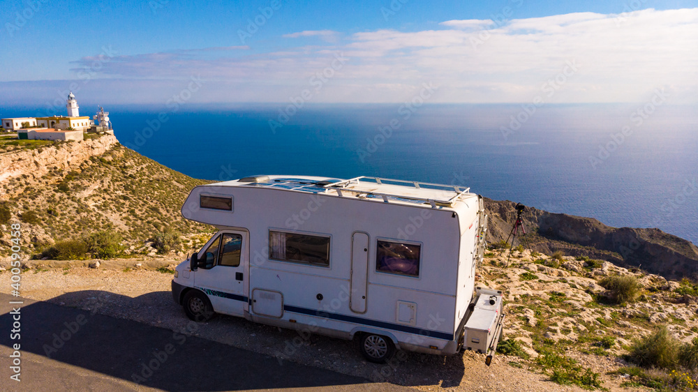 Camper at Mesa Roldan lighthouse, Spain Camper at Mesa Roldan lighthouse, Spain